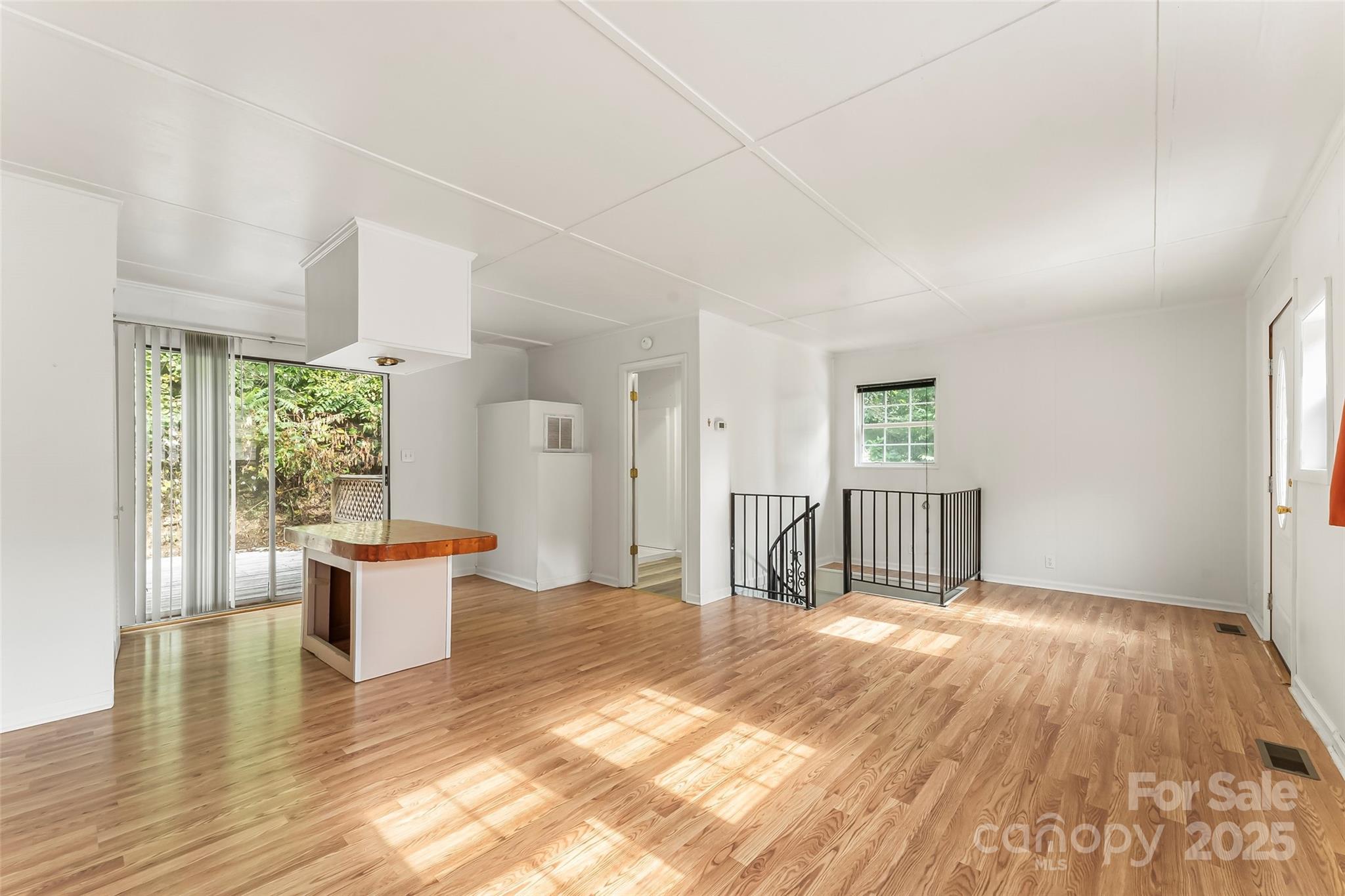 214 Locust Cove Road Marion, NC 28752 - Photo 39 of 47 a view of a room with wooden floor and a window