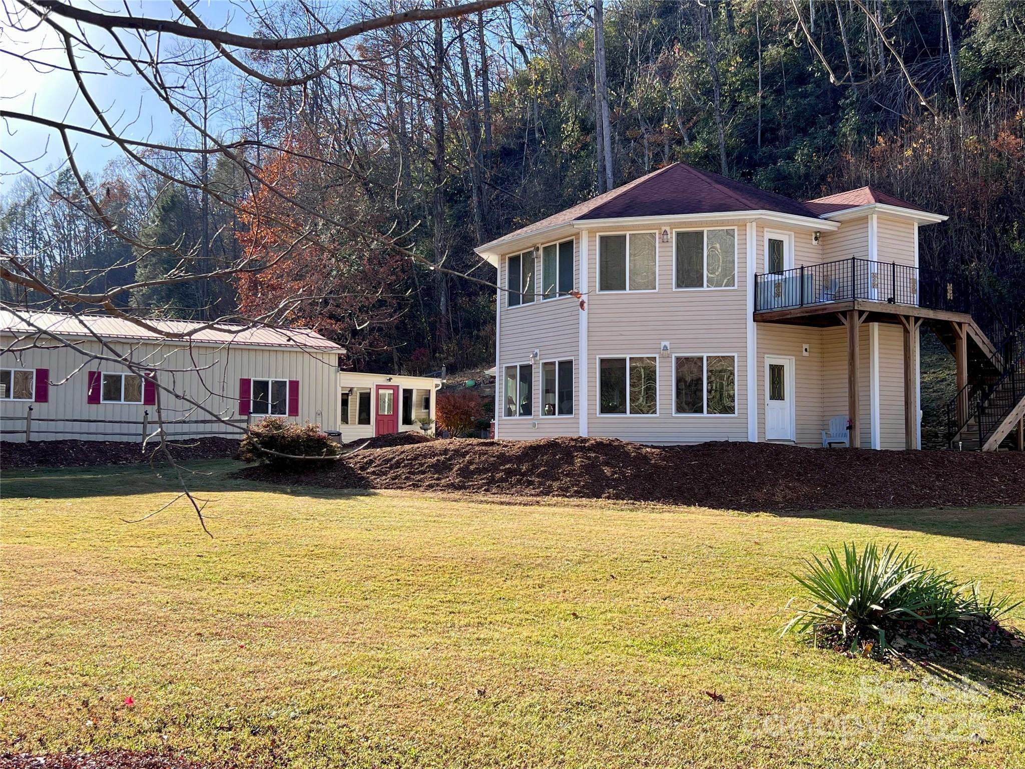 214 Locust Cove Road Marion, NC 28752 - Photo 4 of 47 a front view of a house with swimming pool