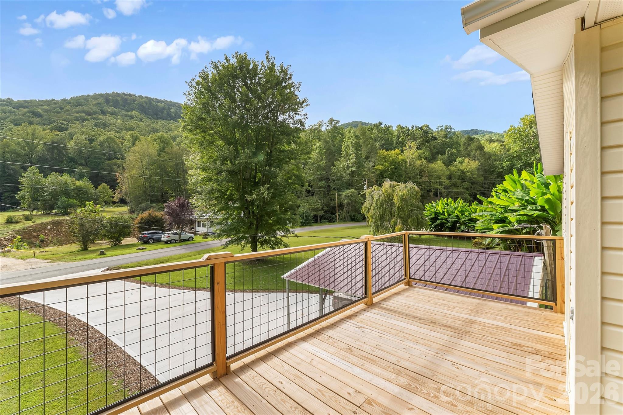 214 Locust Cove Road Marion, NC 28752 - Photo 41 of 47 a view of a balcony with yard