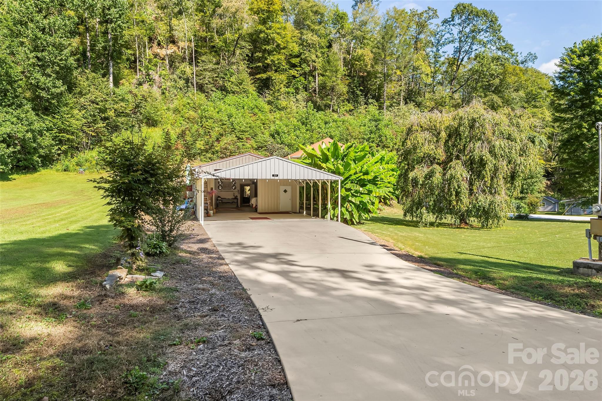 214 Locust Cove Road Marion, NC 28752 - Photo 42 of 47 a house with trees in front of it