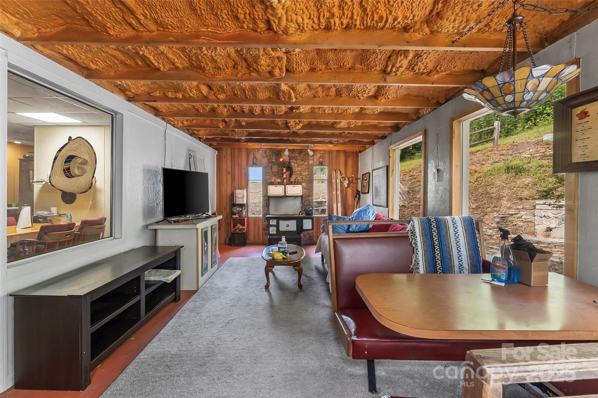 214 Locust Cove Road Marion, NC 28752 - Photo 47 of 47 a living room with furniture and flat screen tv