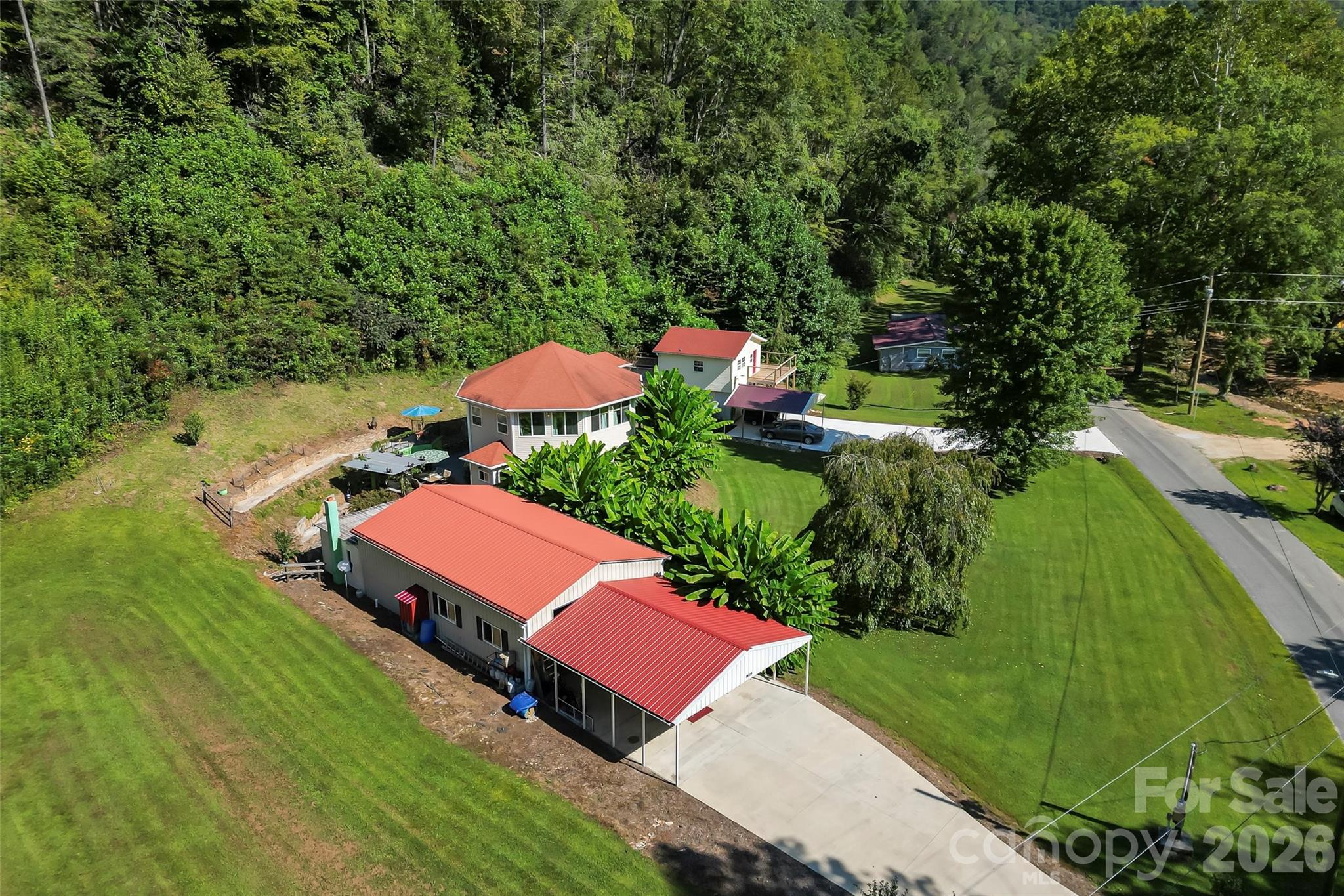 214 Locust Cove Road Marion, NC 28752 - Photo 8 of 47 an aerial view of a house
