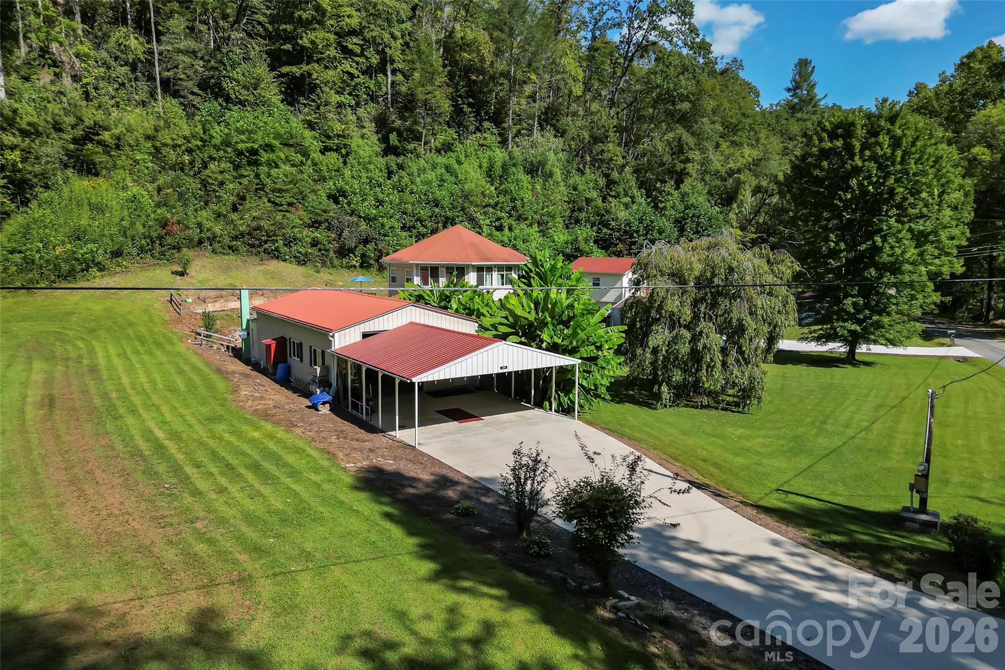214 Locust Cove Road Marion, NC 28752 - Photo 9 of 47 an outdoor space with swimming pool and green space