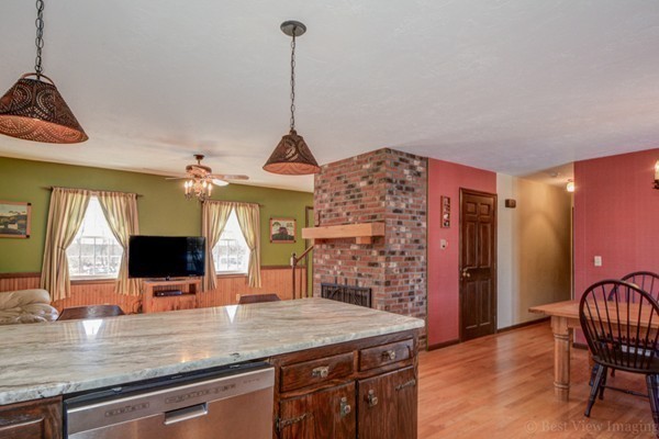 52 Dow Road Hardwick, MA 01037 - Photo 3 of 29 a view of a kitchen with a sink a window and a fireplace