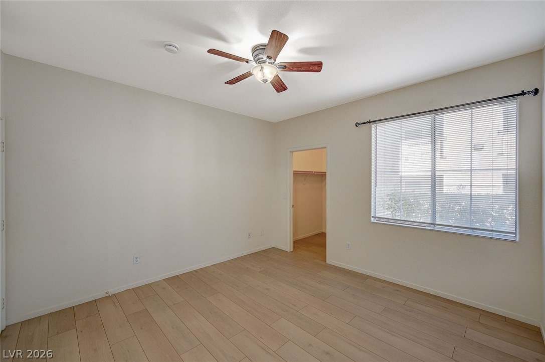 9050 West Warm Springs Road, Unit 1147 Las Vegas, NV 89148 - Photo 23 of 36 Well-lit sleeping quarters feature durable wood flooring and ample space for rest.