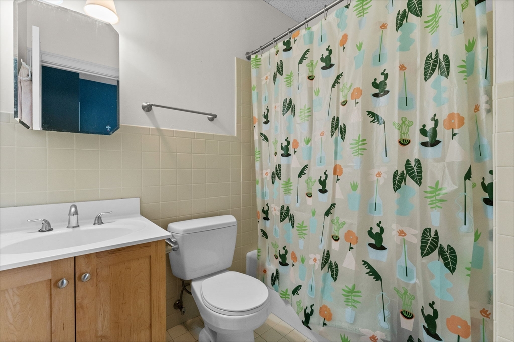 483 Beacon Street, Unit 63 Boston, MA 02115 - Photo 6 of 10 a white toilet sitting next to a bathroom sink
