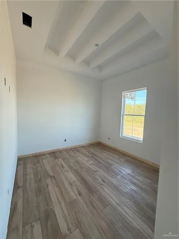 a view of an empty room and window