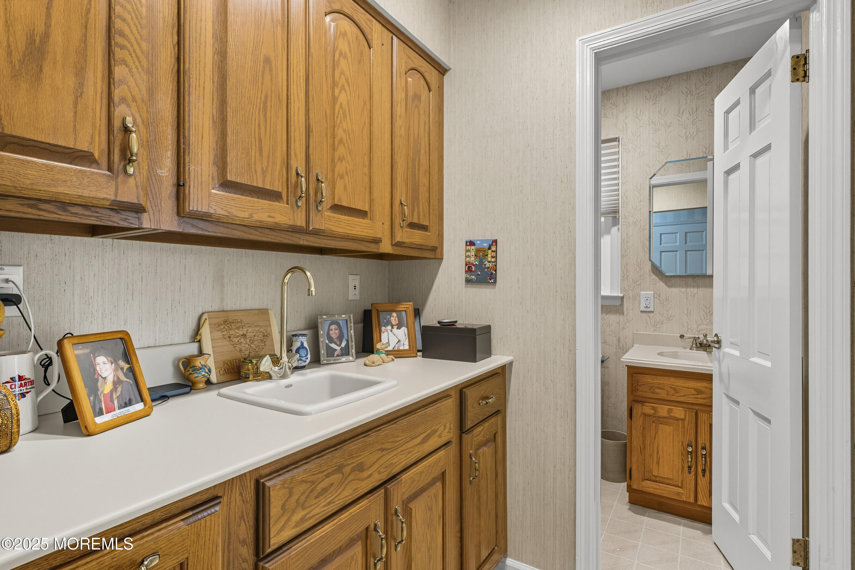 9 Mulberry Lane Colts Neck, NJ 07722 - Photo 11 of 36 a kitchen with stainless steel appliances granite countertop a sink a stove and a wooden cabinets