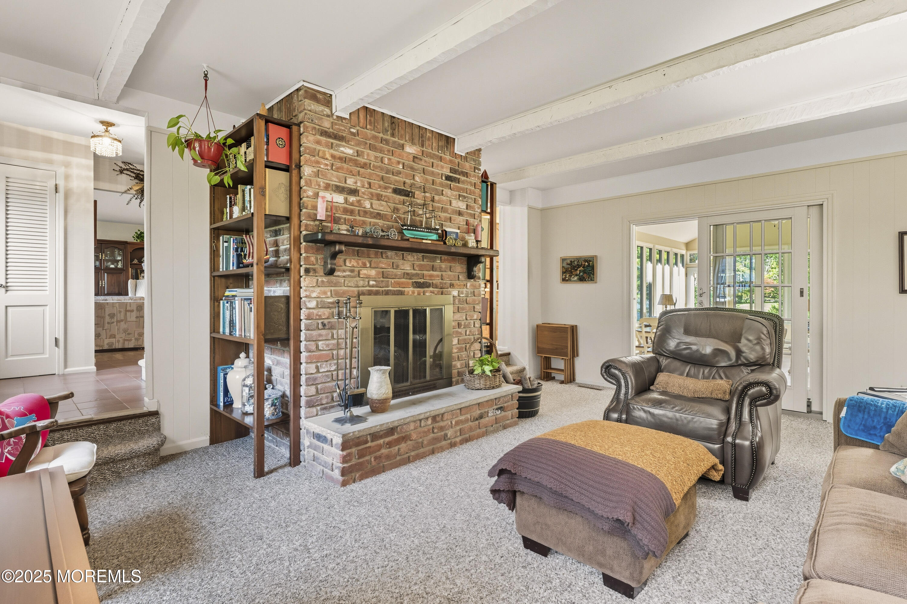 9 Mulberry Lane Colts Neck, NJ 07722 - Photo 16 of 36 a living room with furniture and a fireplace