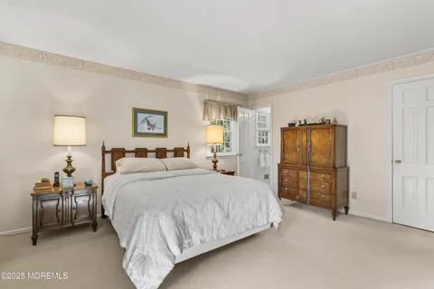 a bedroom with a bed and a lamp