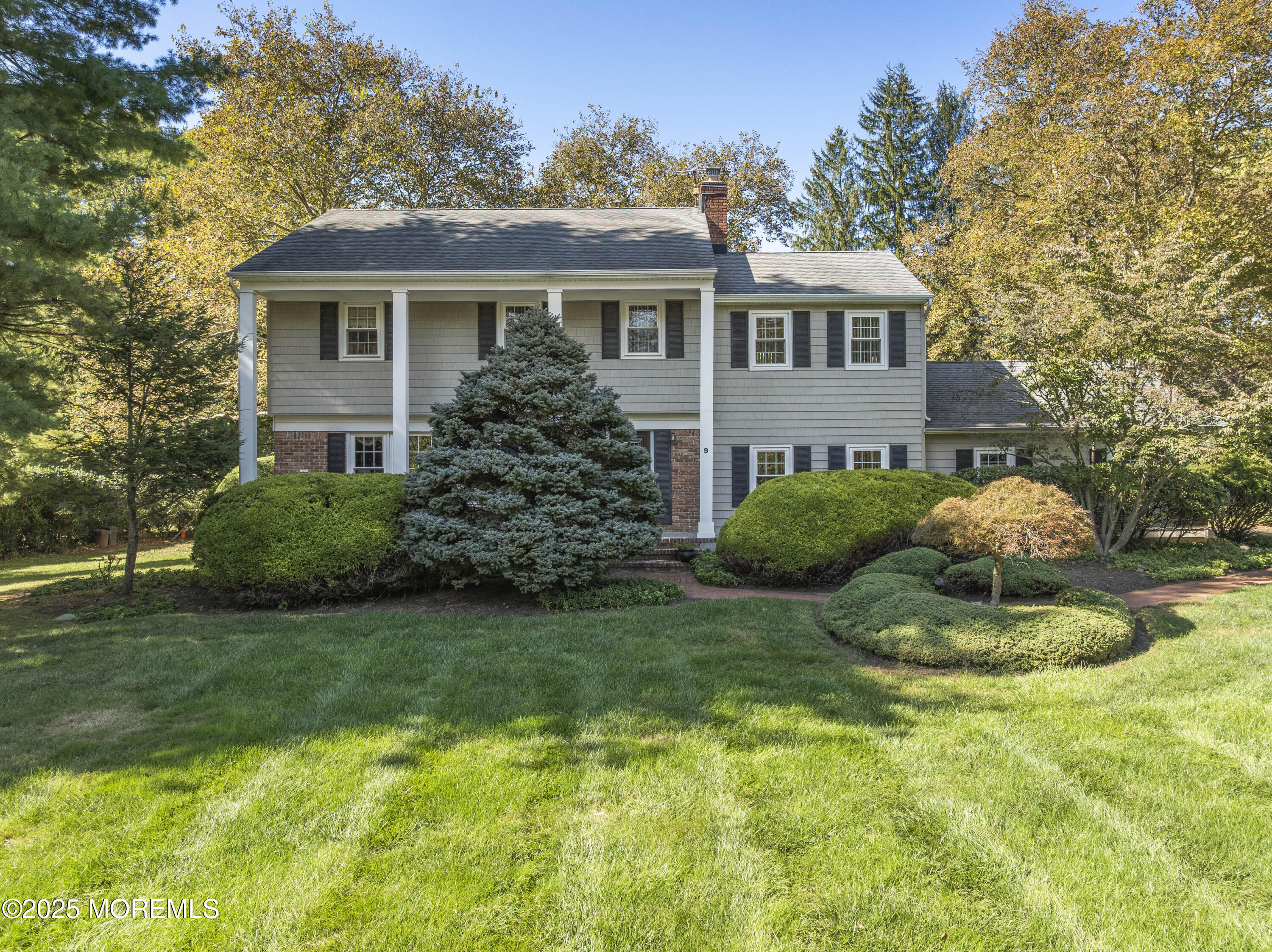 9 Mulberry Lane Colts Neck, NJ 07722 - Photo 2 of 36 a view of a house with a backyard and plants