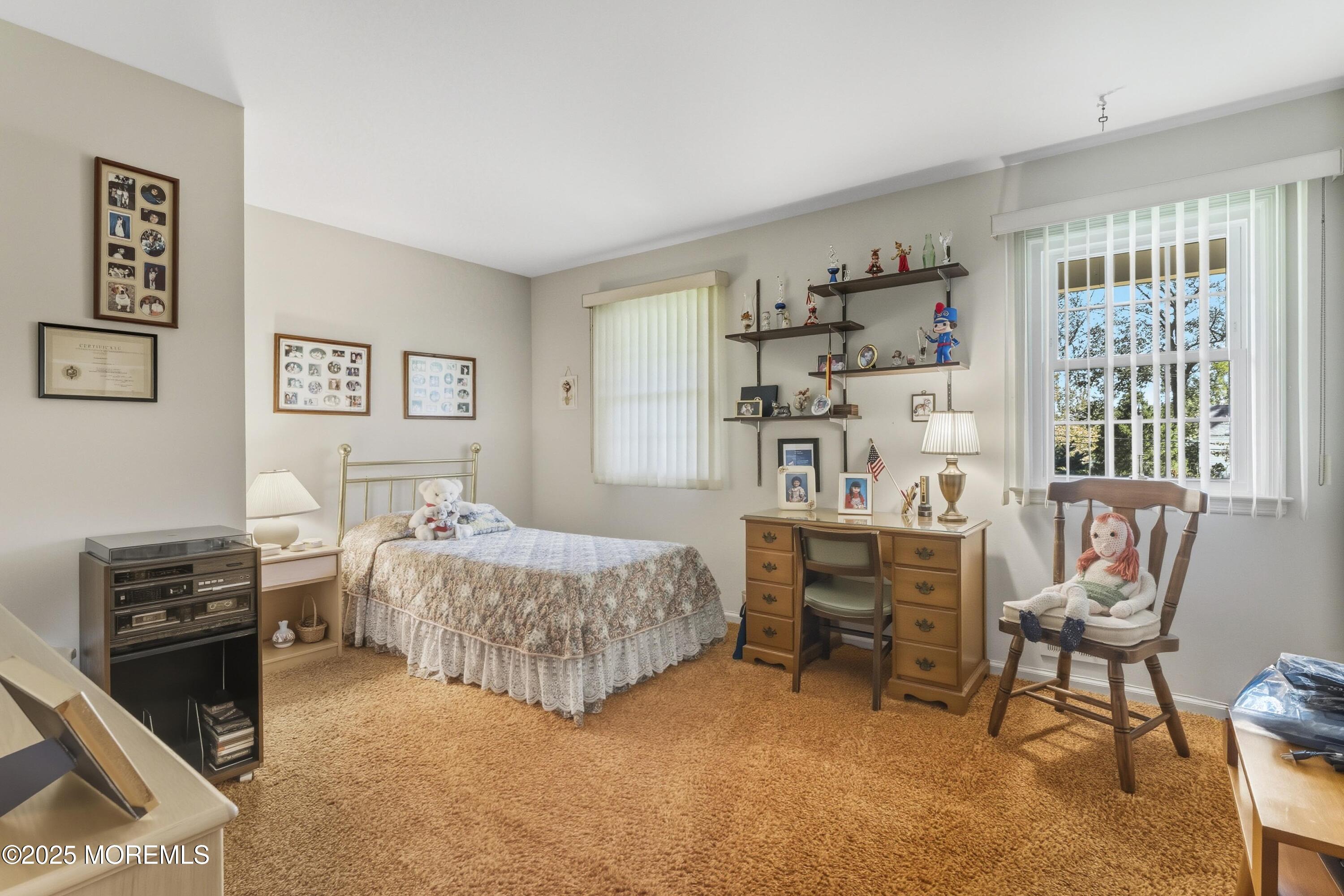 9 Mulberry Lane Colts Neck, NJ 07722 - Photo 24 of 36 a bedroom that has a bed and a chair in it