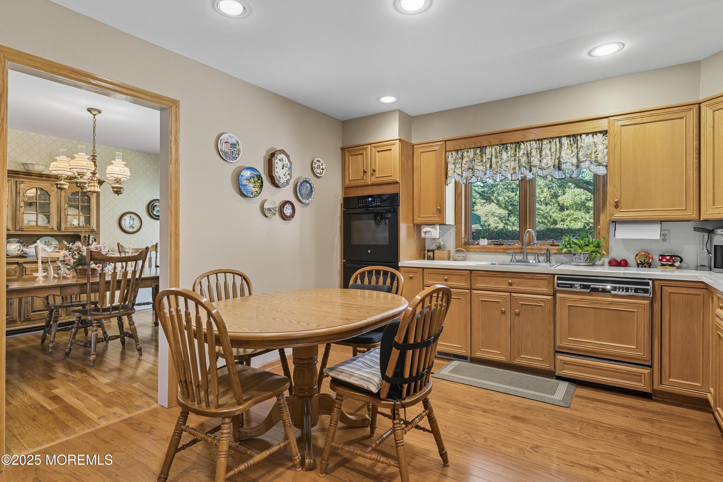 9 Mulberry Lane Colts Neck, NJ 07722 - Photo 7 of 36 a kitchen with granite countertop stainless steel appliances a dining table and chairs
