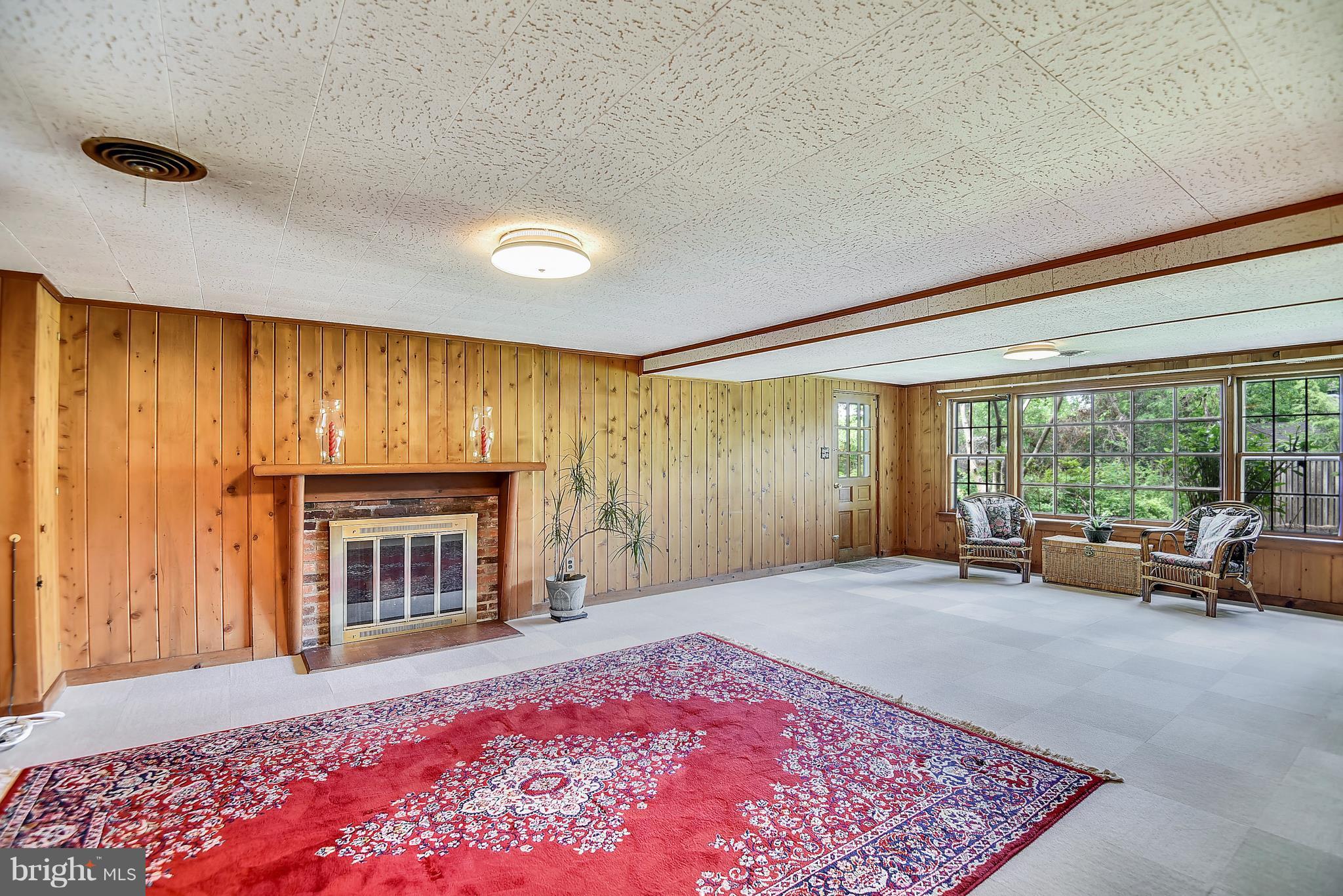 3931 Chesterbrook Road Arlington, VA 22207 - Photo 27 of 28 Lower level family/rec room with fireplace and w/o
