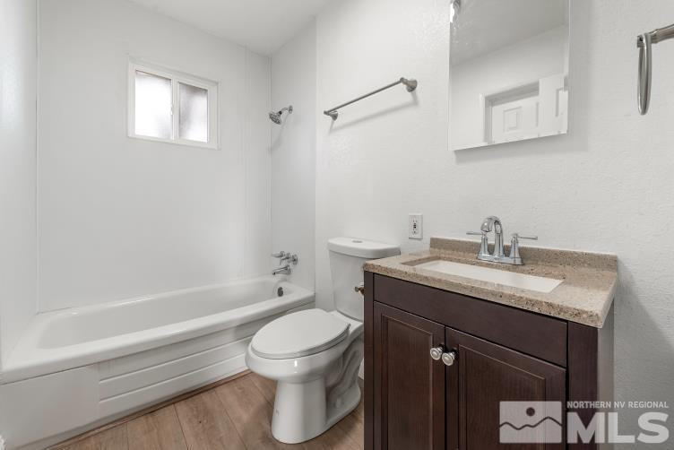 565 Colorado River Boulevard Reno, NV 89502 - Photo 11 of 25 a bathroom with a granite countertop sink toilet and shower