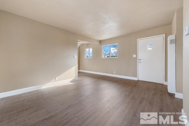 565 Colorado River Boulevard Reno, NV 89502 - Photo 2 of 25 a view of a livingroom with wooden floor and an entryway