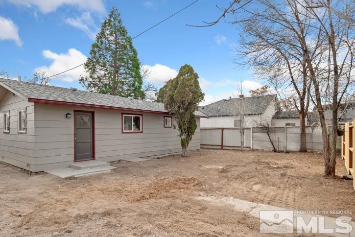 565 Colorado River Boulevard Reno, NV 89502 - Photo 22 of 25 a view of a house with a yard and garage
