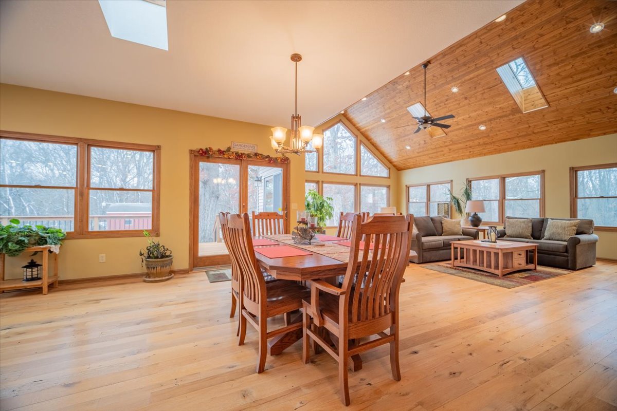 11000 Pear Tree Road Dewitt, IL 61735 - Photo 12 of 30 a dining room with furniture a chandelier and wooden floor