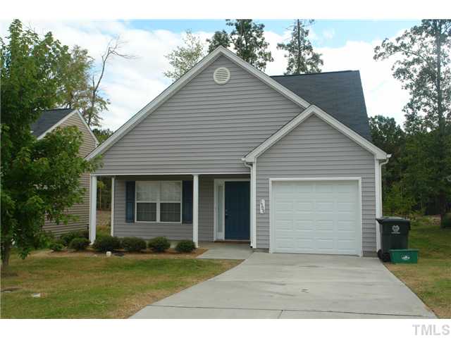 1508 Ricochet Drive Raleigh, NC 27610 - Photo 1 of 8 a front view of a house with a garden