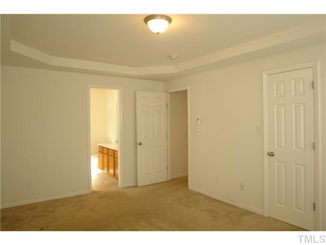 1508 Ricochet Drive Raleigh, NC 27610 - Photo 6 of 8 a view of an empty room and window