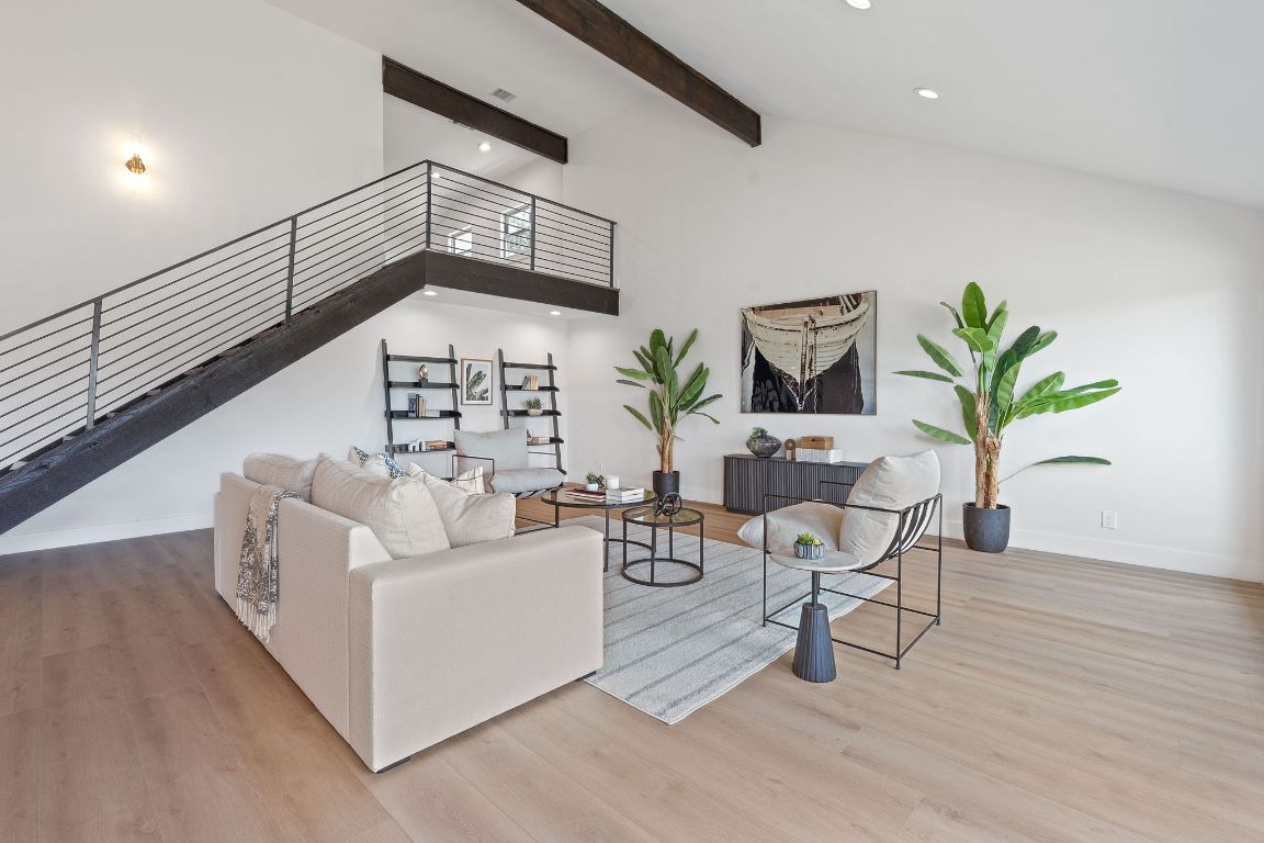 1325 Likeness Road Spicewood, TX 78669 - Photo 4 of 38 Living room with beam ceiling, recessed lighting, wood finished floors, and high vaulted ceiling