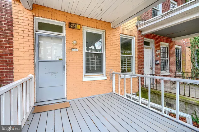 a view of a house with wooden deck