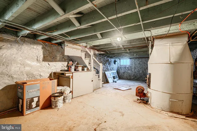 a view of a storage room with refrigerator and washer