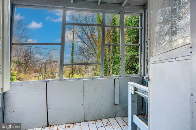 a view of a balcony with wooden floor