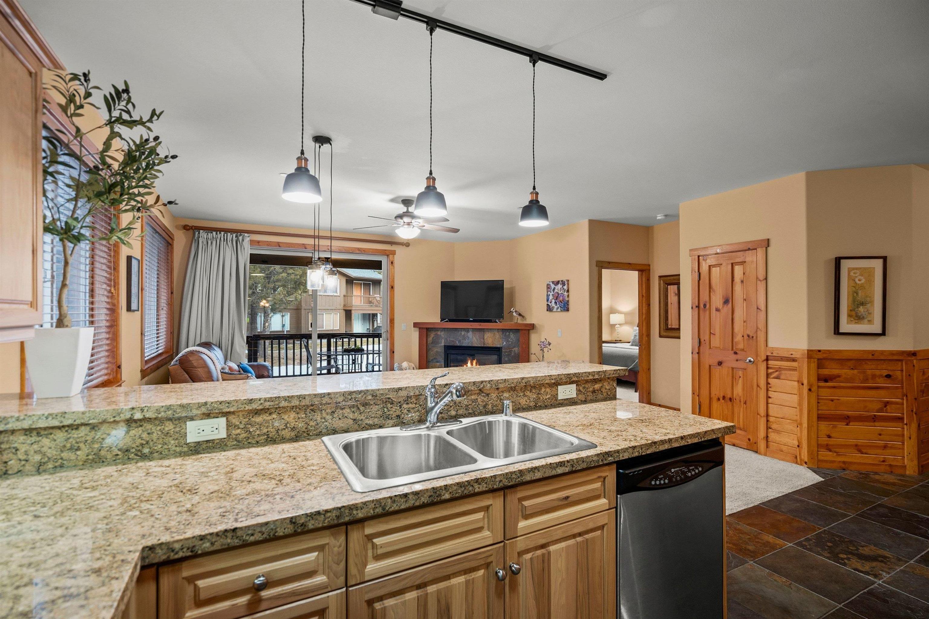 11420 Dolomite Way, Unit 1 Truckee, CA 96161 - Photo 11 of 28 a kitchen with stainless steel appliances granite countertop a sink a counter space and a refrigerator
