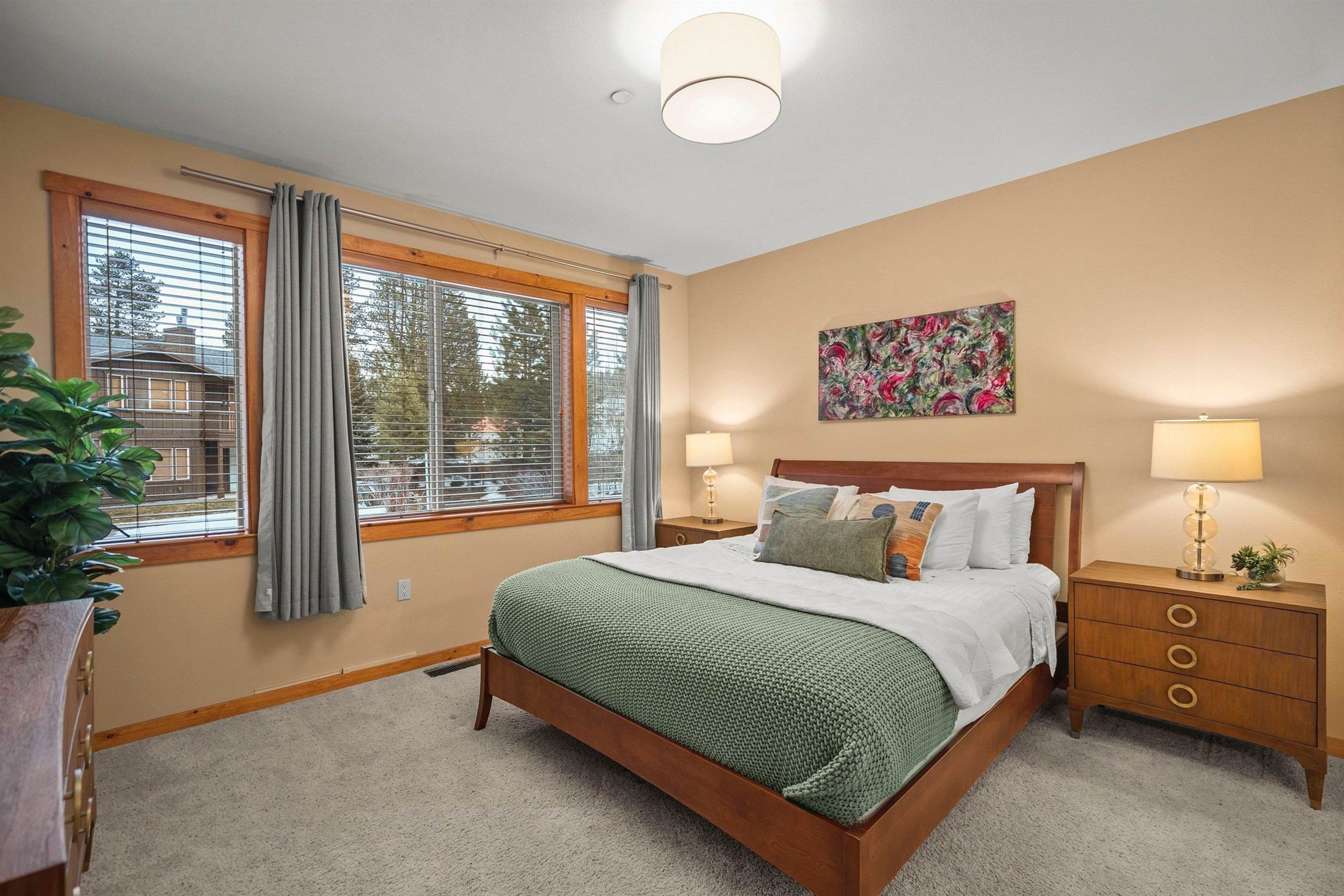 11420 Dolomite Way, Unit 1 Truckee, CA 96161 - Photo 12 of 28 a bedroom with a large bed and a large window