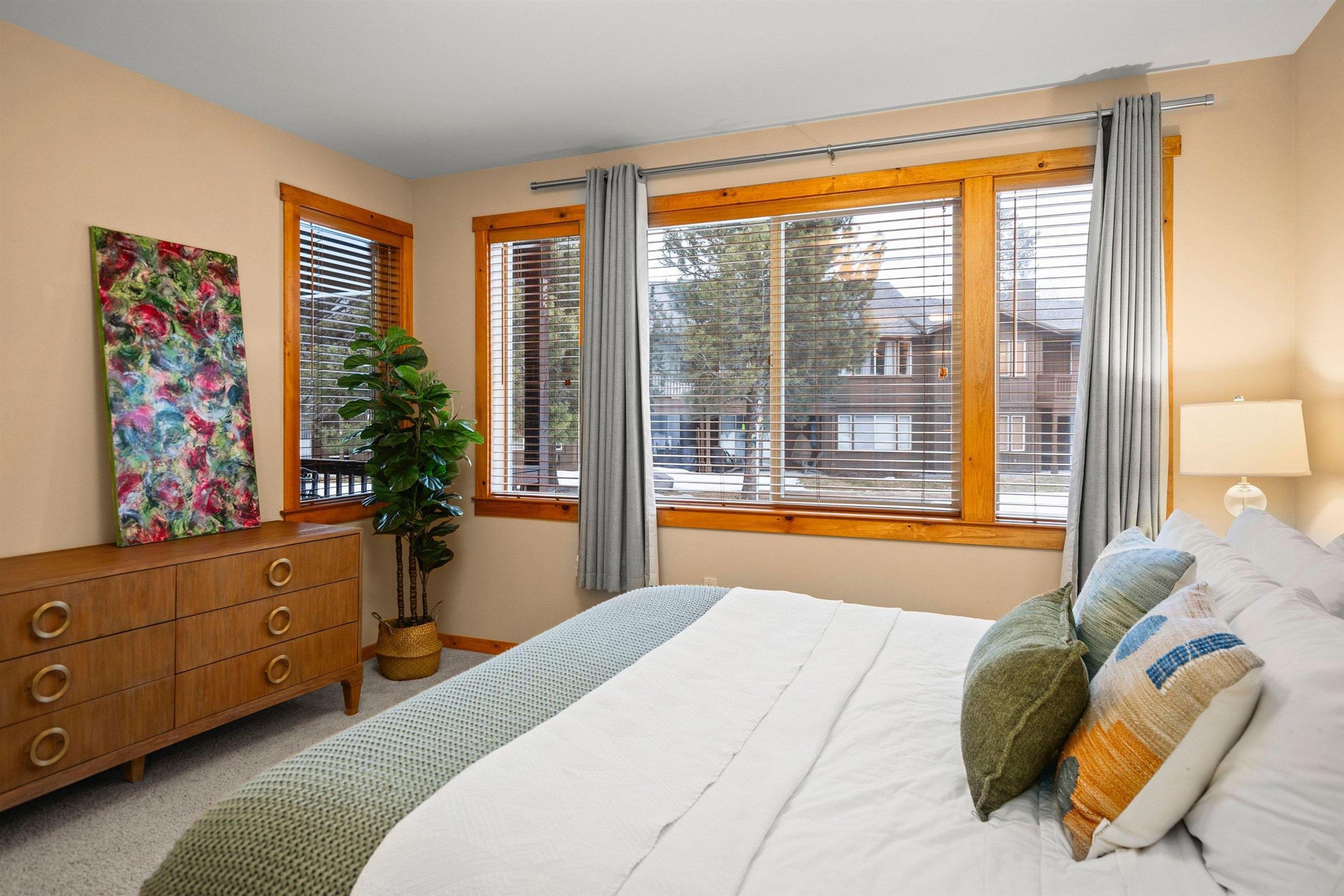 11420 Dolomite Way, Unit 1 Truckee, CA 96161 - Photo 13 of 28 a bedroom with a bed and a dresser next to a window