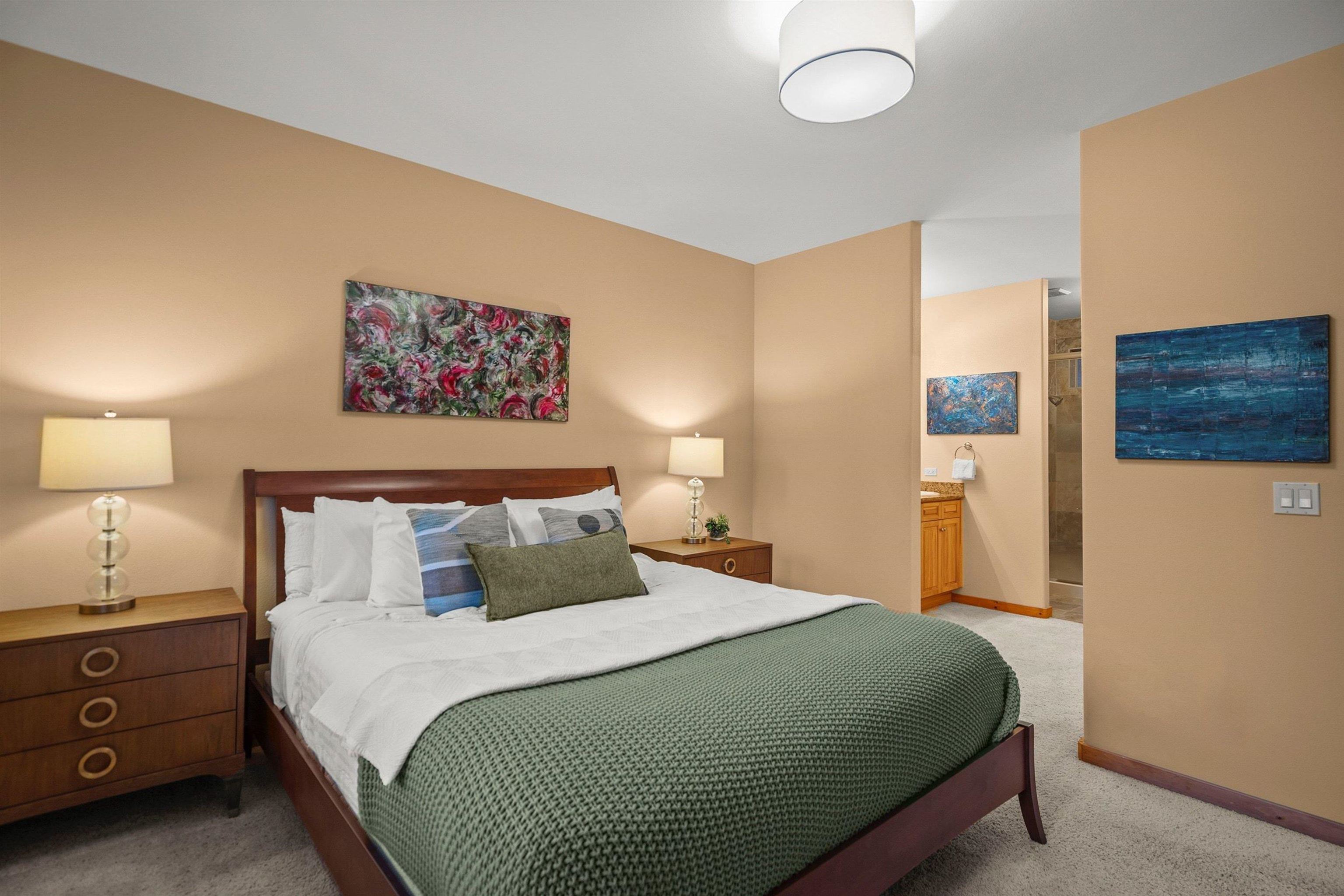 11420 Dolomite Way, Unit 1 Truckee, CA 96161 - Photo 14 of 28 a bedroom with a bed and painting on the wall