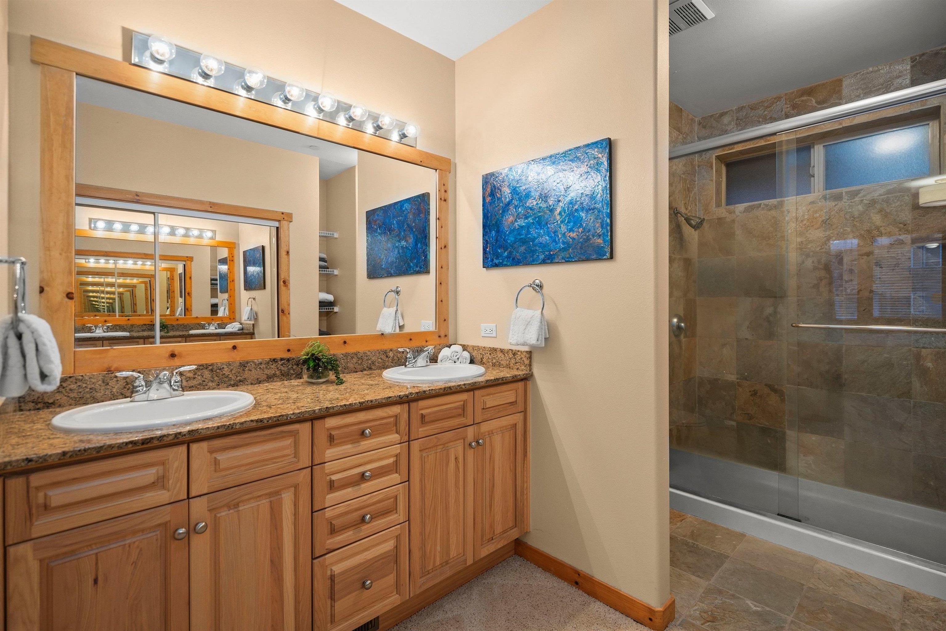 11420 Dolomite Way, Unit 1 Truckee, CA 96161 - Photo 15 of 28 a bathroom with a granite countertop sink mirror and double