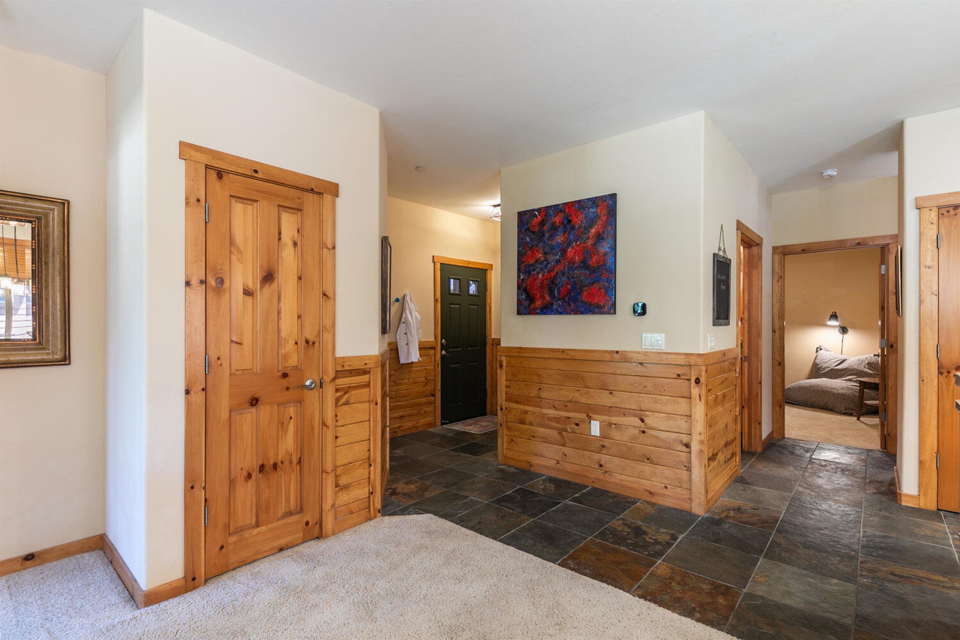 11420 Dolomite Way, Unit 1 Truckee, CA 96161 - Photo 16 of 28 a view of hallway with a couch and a dresser