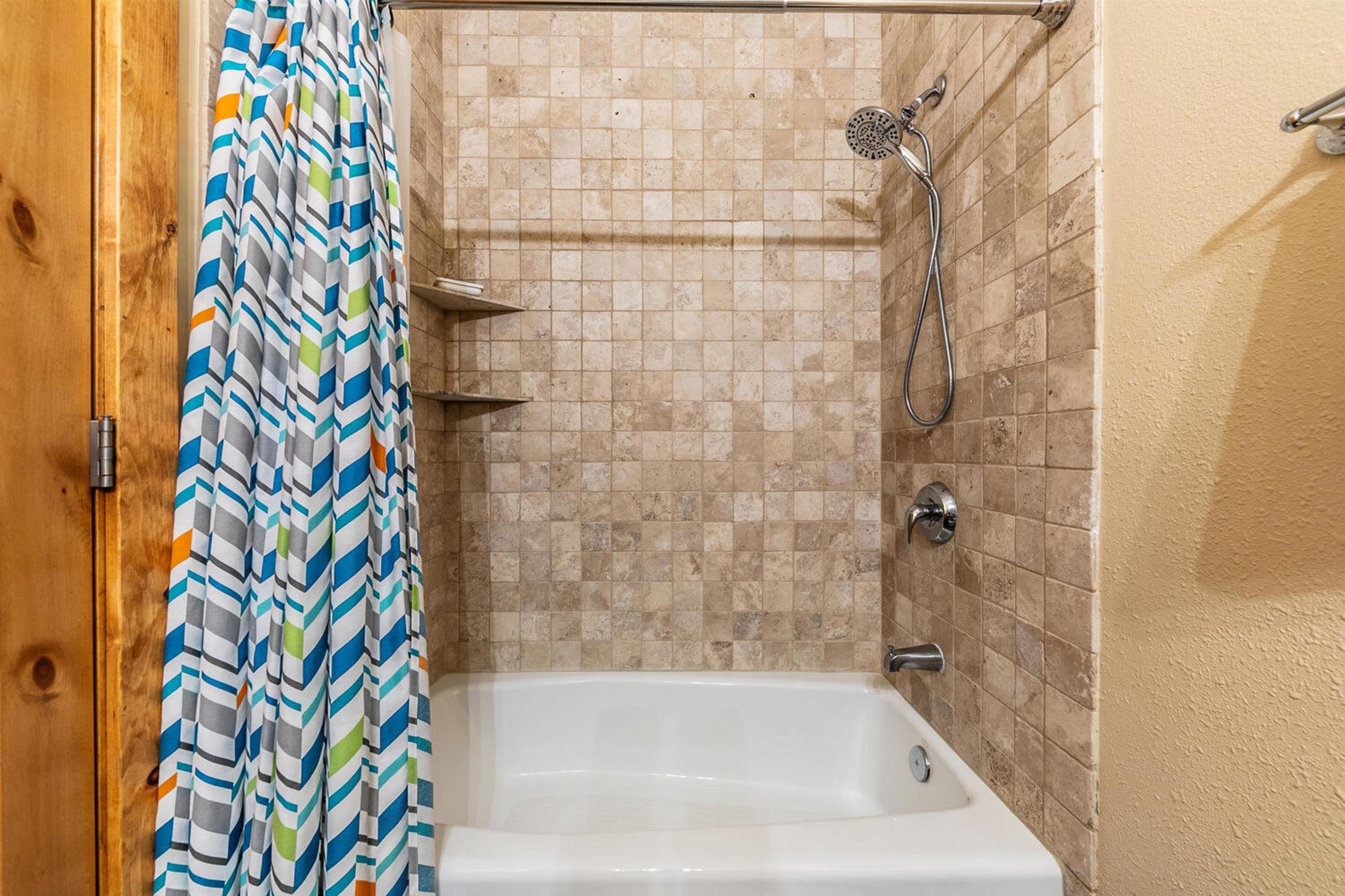 11420 Dolomite Way, Unit 1 Truckee, CA 96161 - Photo 19 of 28 a bathroom with a bath tub