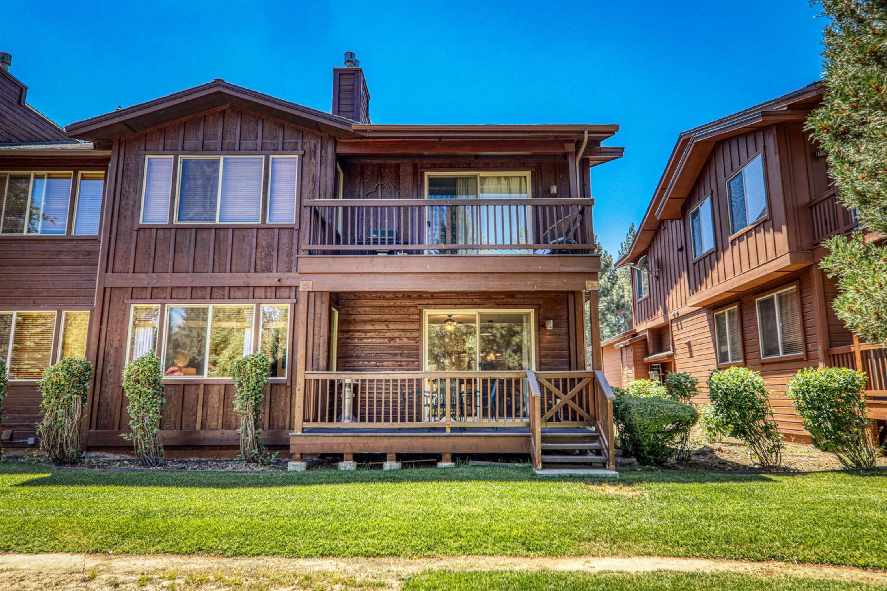 11420 Dolomite Way, Unit 1 Truckee, CA 96161 - Photo 22 of 28 a view of front of a brick house with a yard