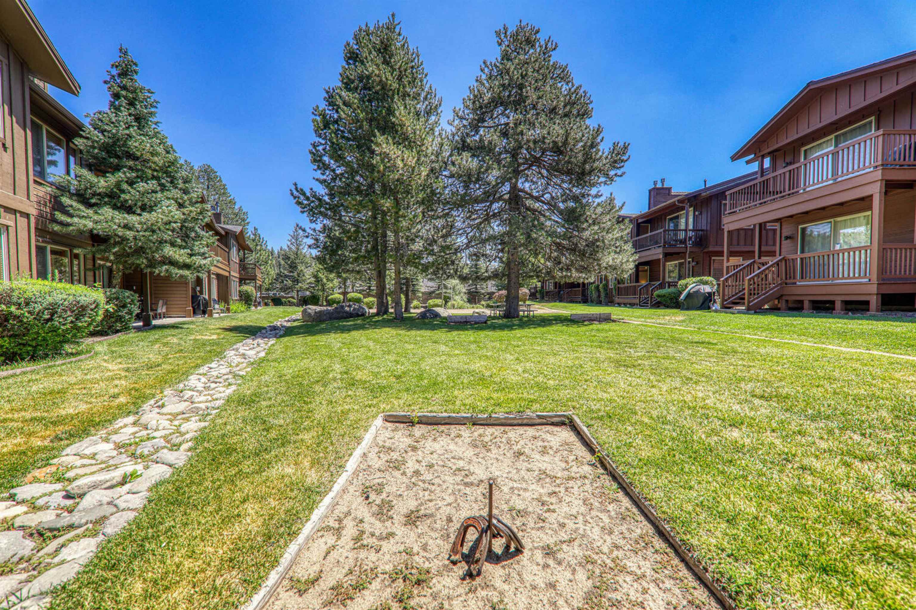11420 Dolomite Way, Unit 1 Truckee, CA 96161 - Photo 24 of 28 a view of a yard with plants and trees