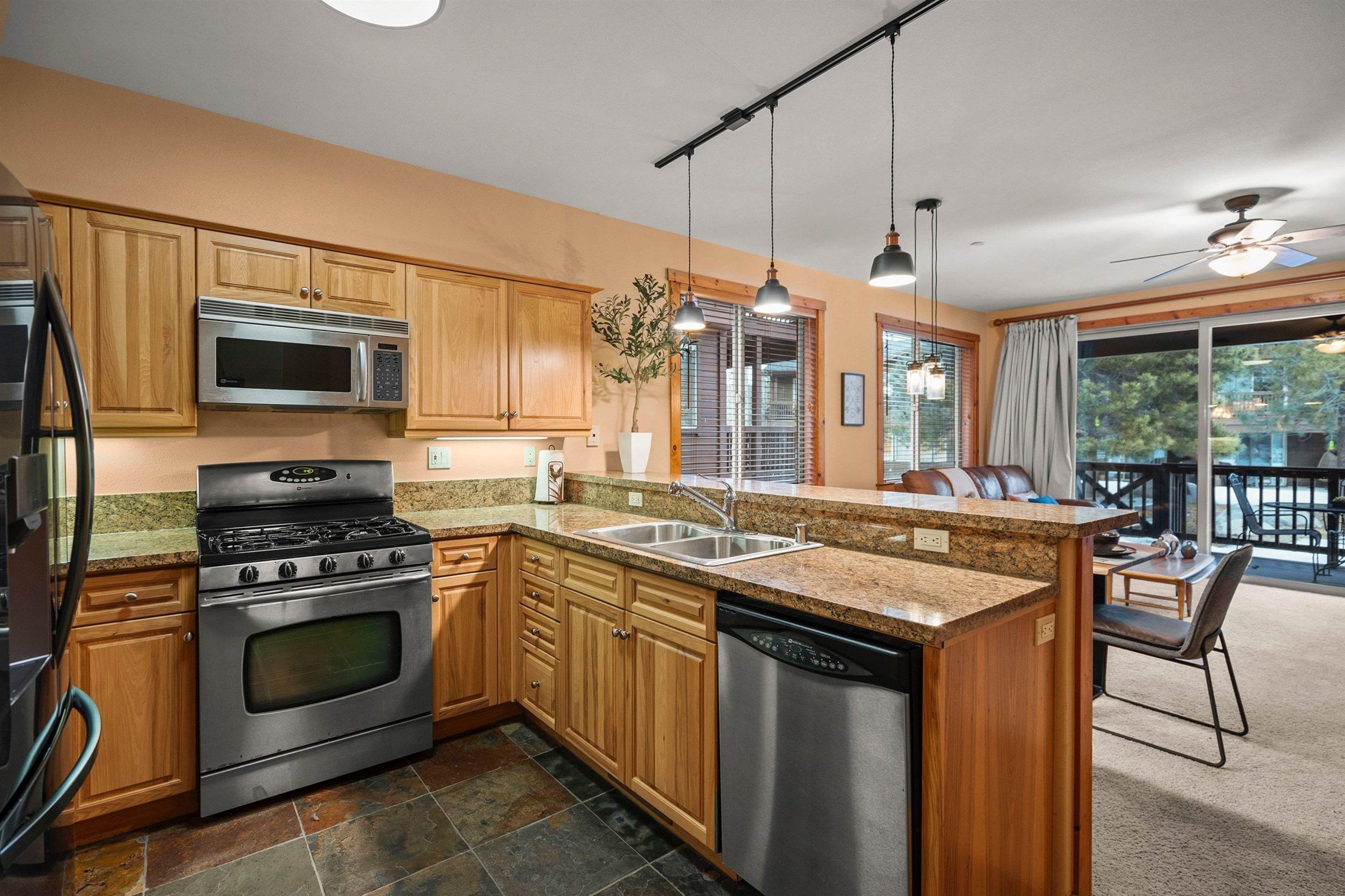 11420 Dolomite Way, Unit 1 Truckee, CA 96161 - Photo 8 of 28 a kitchen with a stove and a microwave