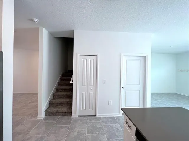 a view of a hallway with staircase