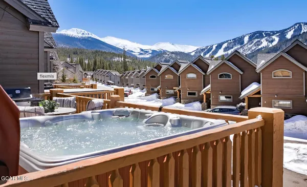 a view of a balcony with table and chairs