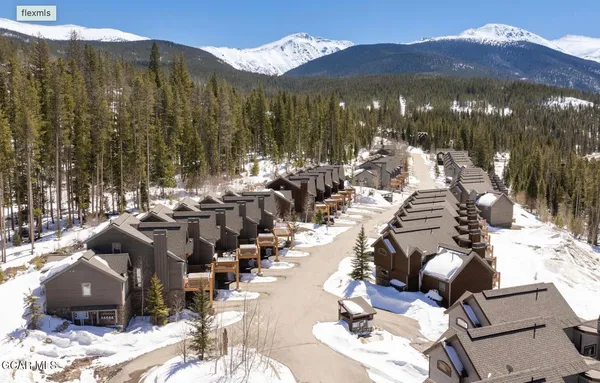 a view of a roof deck with furniture