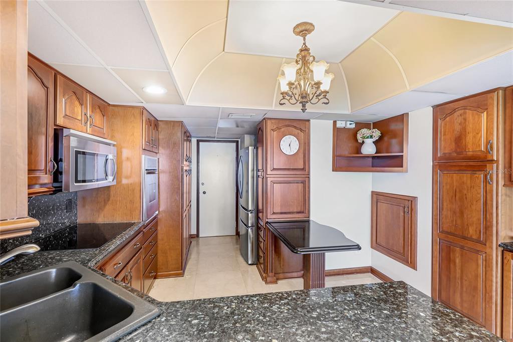 603 Longboat Club Road, Unit 1103N Longboat Key, FL 34228 - Photo 11 of 37 a view of living room kitchen and dining room