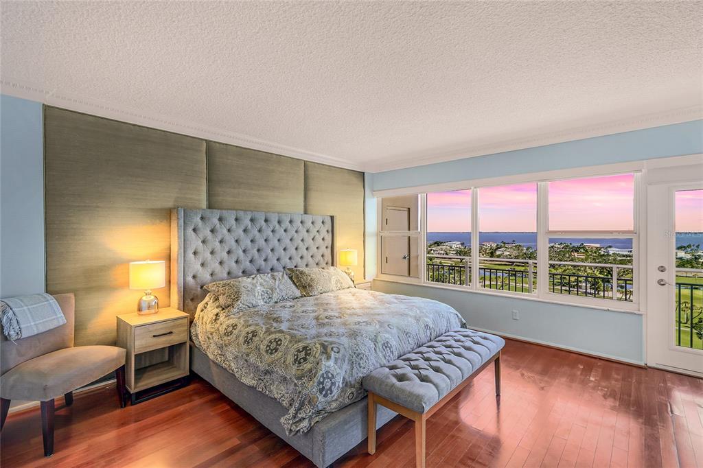 603 Longboat Club Road, Unit 1103N Longboat Key, FL 34228 - Photo 17 of 37 a bedroom with a large bed and a window