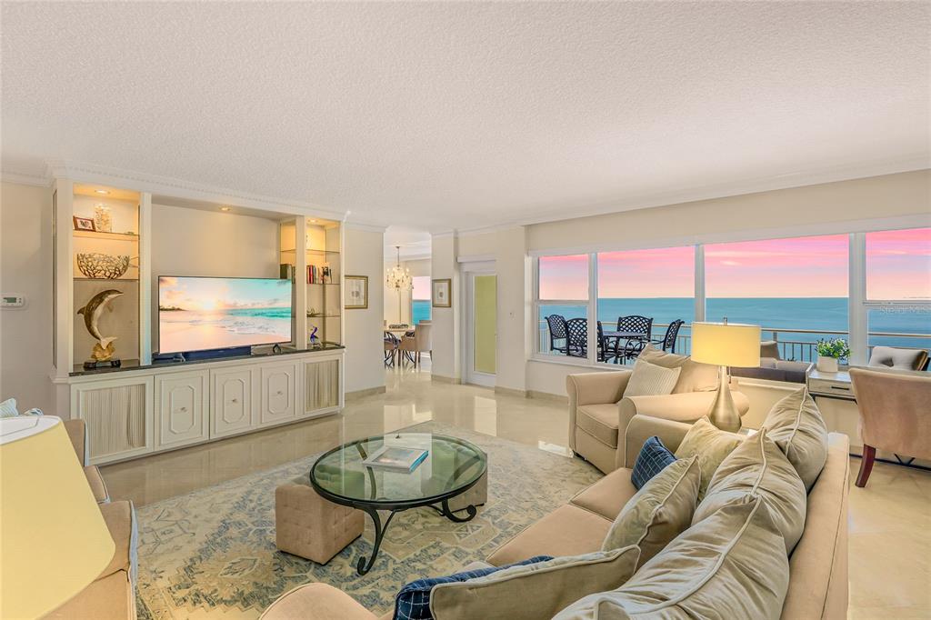 603 Longboat Club Road, Unit 1103N Longboat Key, FL 34228 - Photo 2 of 37 a living room with furniture and a large window