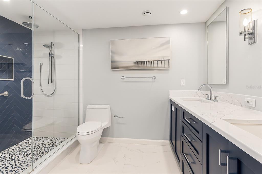 603 Longboat Club Road, Unit 1103N Longboat Key, FL 34228 - Photo 21 of 37 a spacious bathroom with a sink toilet and shower