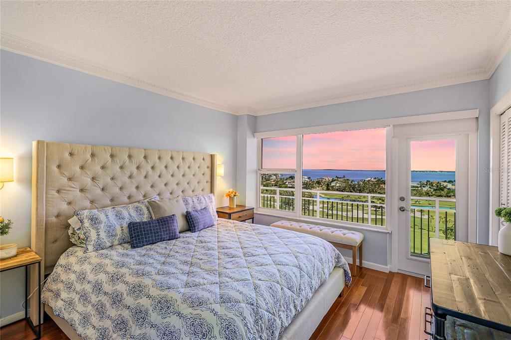 603 Longboat Club Road, Unit 1103N Longboat Key, FL 34228 - Photo 22 of 37 a bedroom with a large bed and a large window