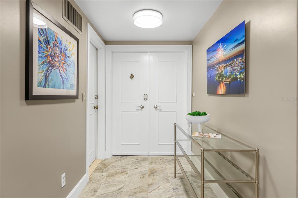 603 Longboat Club Road, Unit 1103N Longboat Key, FL 34228 - Photo 28 of 37 a view of painting on the wall in a room