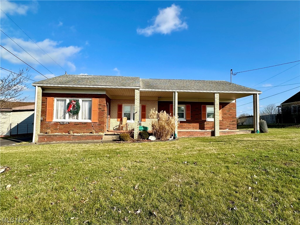 351 Rockdale Road Follansbee, WV 26037 - Photo 1 of 18 Ranch-style house with a front lawn and a porch