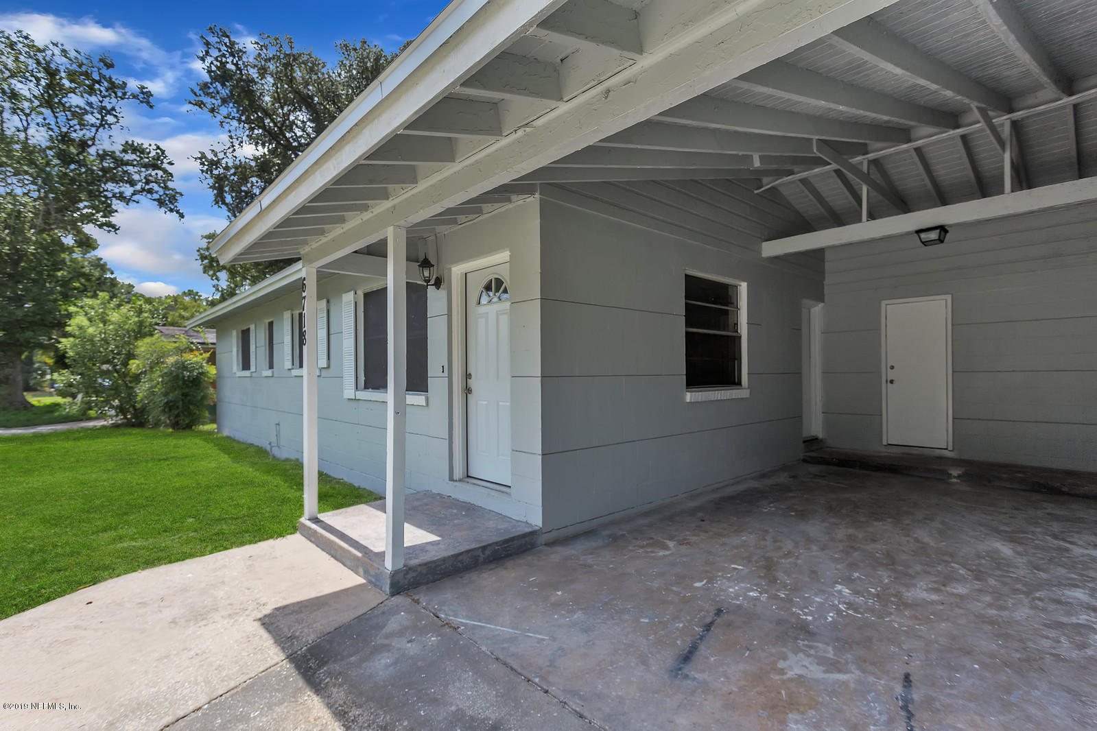 6718 Cavalier Road Jacksonville, FL 32208 - Photo 1 of 15 a view of backyard with green space
