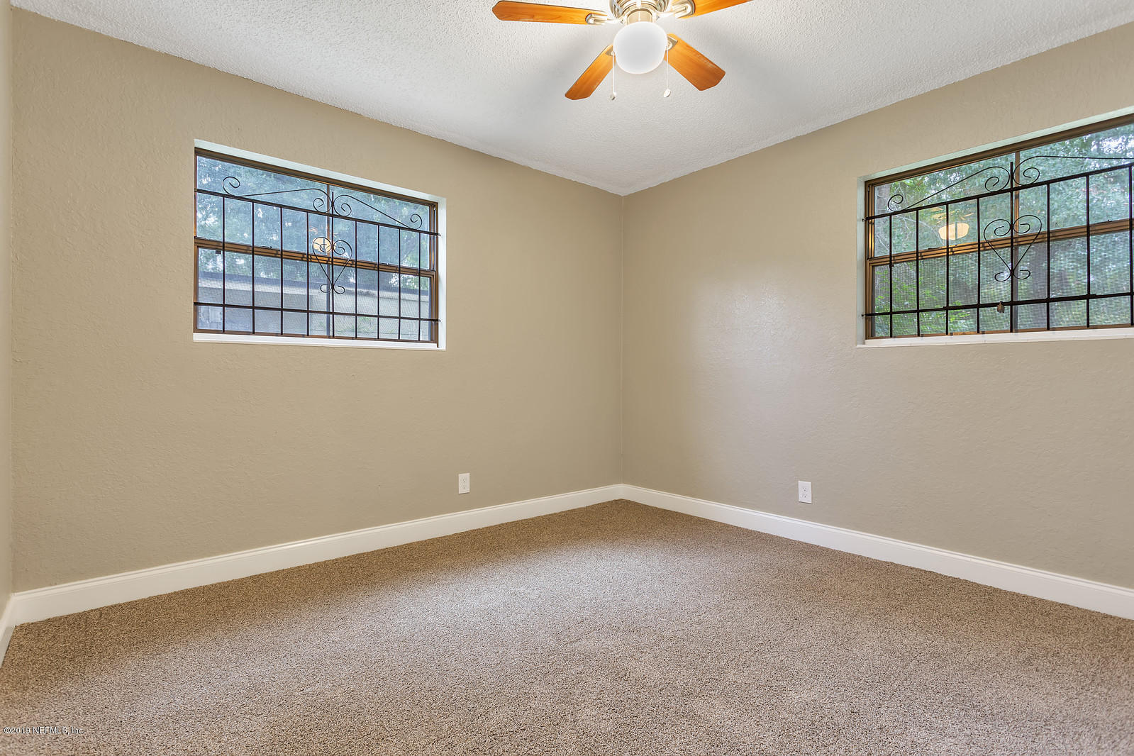 6718 Cavalier Road Jacksonville, FL 32208 - Photo 14 of 15 a view of an empty room with a window